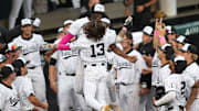 Vanderbilt infielder Jonathan Vastine (13) celebrates with Vanderbilt utility RJ Austin (42) after Vastine hits a home run during a NCAA baseball game between the Tennessee Volunteers and Vanderbilt Commodores at Lindsey Nelson Stadium on May 11, 2025. Vanderbilt won 7-5 against Tennessee.