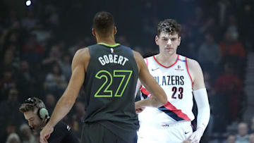 Nov 13, 2024; Portland, Oregon, USA; Minnesota Timberwolves center Rudy Gobert (27) and Portland Trail Blazers center Donovan Clingan (23) greet before the tip off at Moda Center. Mandatory Credit: Soobum Im-Imagn Images