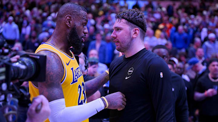 Dec 12, 2023; Dallas, Texas, USA; Los Angeles Lakers forward LeBron James (23) talks with Dallas Mavericks guard Luka Doncic (77) after the Mavericks defeat the Lakes at the American Airlines Center. Mandatory Credit: Jerome Miron-Imagn Images