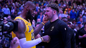 Dec 12, 2023; Dallas, Texas, USA; Los Angeles Lakers forward LeBron James (23) talks with Dallas Mavericks guard Luka Doncic (77) after the Mavericks defeat the Lakes at the American Airlines Center. Mandatory Credit: Jerome Miron-Imagn Images