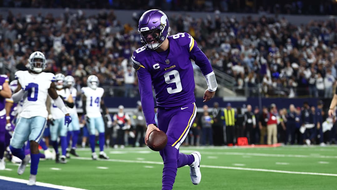 Dec 14, 2025; Arlington, Texas, USA; Minnesota Vikings quarterback J.J. McCarthy (9) runs for a touchdown during the first half against the Dallas Cowboys at AT&T Stadium.