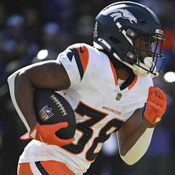 Nov 3, 2024; Baltimore, Maryland, USA;  Denver Broncos running back Jaleel McLaughlin (38) rushes during the first half against the Baltimore Ravens at M&T Bank Stadium. 