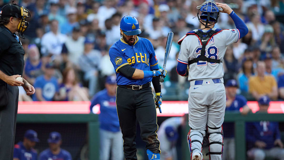 Aug 1, 2025; Seattle, Washington, USA; Seattle Mariners third baseman Eugenio Suarez (28) reacts after a strike out against the Texas Rangers during the third inning at T-Mobile Park. Mandatory Credit: John Froschauer-Imagn Images