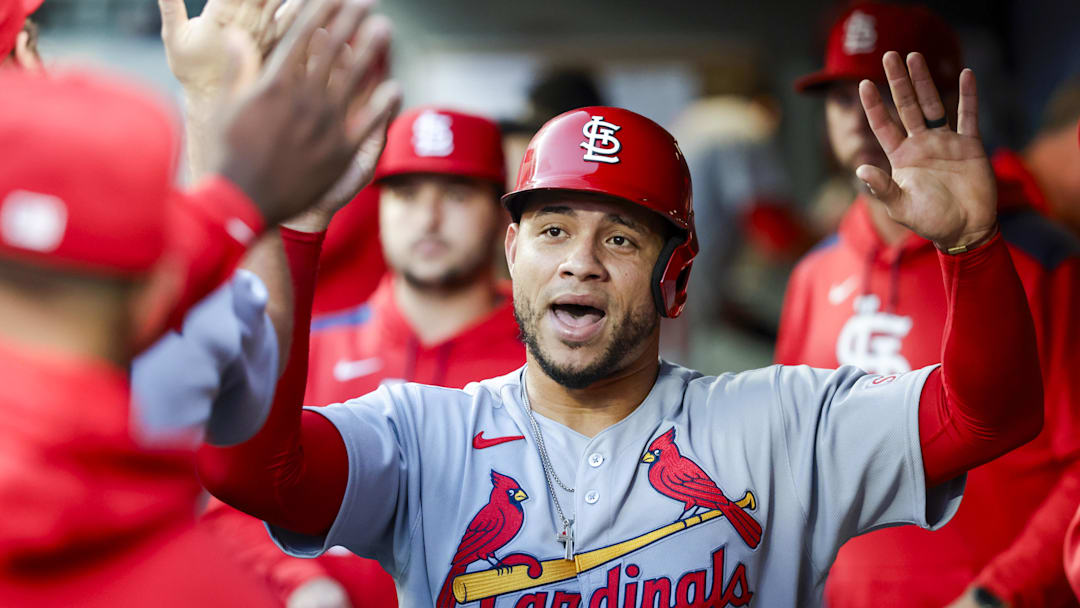 Sep 9, 2025; Seattle, Washington, USA; St. Louis Cardinals first baseman Willson Contreras (40) high-fives teammates in the dugout after scoring a run against the Seattle Mariners during the second inning at T-Mobile Park. Mandatory Credit: Joe Nicholson-Imagn Images