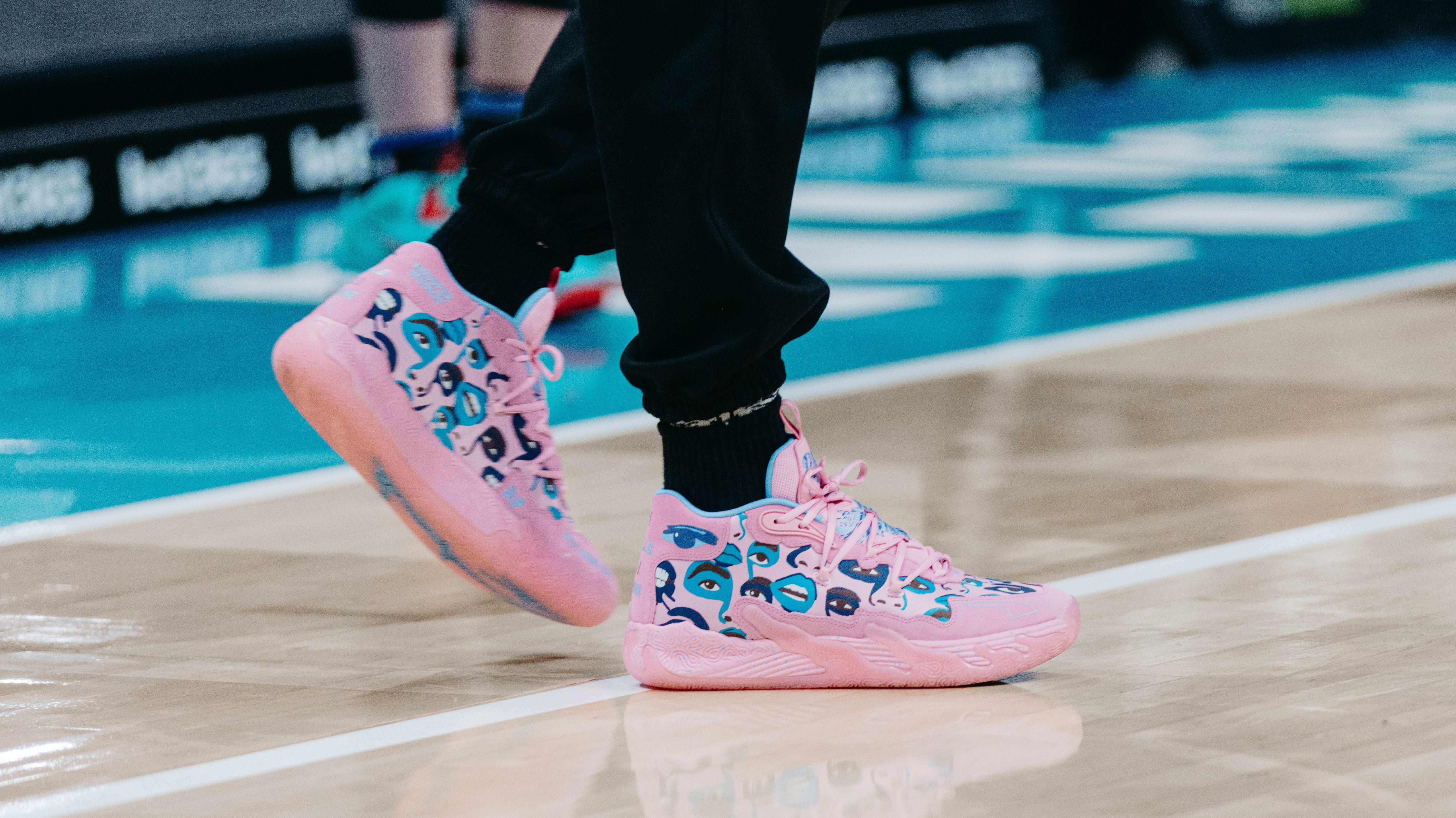 LaMelo Ball's pink and blue PUMA sneakers.