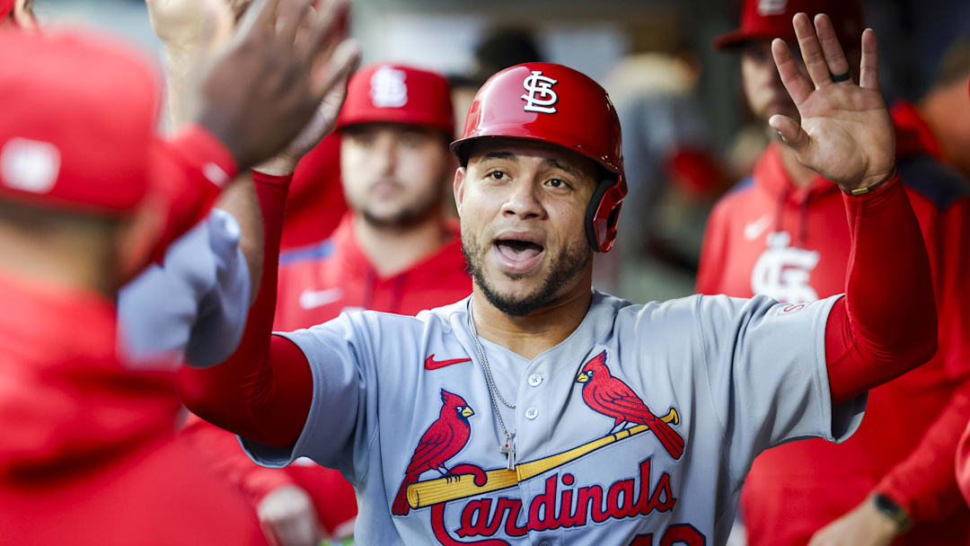 Sep 9, 2025; Seattle, Washington, USA; St. Louis Cardinals first baseman Wilson Contreras (40) high-fives teammates in the dugout after scoring a run against the Seattle Mariners during the second inning at T-Mobile Park. Mandatory Credit: Joe Nicholson-Imagn Images
