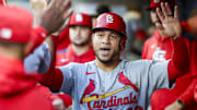 Sep 9, 2025; Seattle, Washington, USA; St. Louis Cardinals first baseman Wilson Contreras (40) high-fives teammates in the dugout after scoring a run against the Seattle Mariners during the second inning at T-Mobile Park. Mandatory Credit: Joe Nicholson-Imagn Images