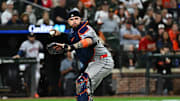 Aug 21, 2025; Baltimore, Maryland, USA;  Houston Astros catcher Victor Caratini (17) throws to first base during the seventh inning against the Baltimore Orioles at Oriole Park at Camden Yards. 