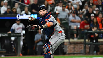 Aug 21, 2025; Baltimore, Maryland, USA;  Houston Astros catcher Victor Caratini (17) throws to first base during the seventh inning against the Baltimore Orioles at Oriole Park at Camden Yards. 