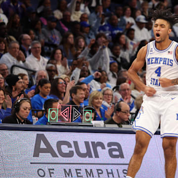 Jan 26, 2025; Memphis, Tennessee, USA; Memphis Tigers guard PJ Haggerty (4) reacts after a three point basket against the UAB Blazers during the second half at FedExForum. Mandatory Credit: Wesley Hale-Imagn Images