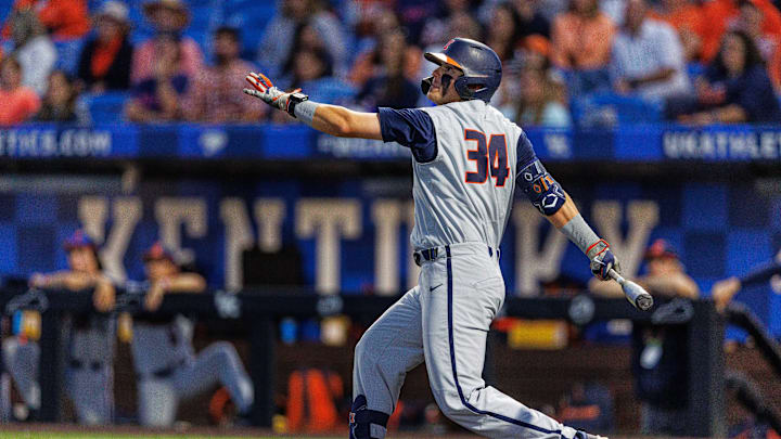 May 31, 2024; Lexington, KY, USA;  Illinois infielder Drake Westcott (34) hits a double during the eighth inning of a NCAA Division I Baseball Championship game between the Indiana State Sycamores and Illinois Fighting Illini at Kentucky Proud Park. Mandatory Credit: Jordan Prather-Imagn Images