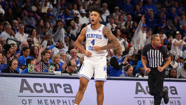 Jan 26, 2025; Memphis, Tennessee, USA; Memphis Tigers guard PJ Haggerty (4) reacts after a three point basket against the UAB Blazers during the second half at FedExForum. Mandatory Credit: Wesley Hale-Imagn Images