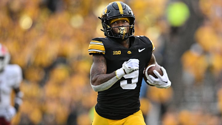 Sep 14, 2024; Iowa City, Iowa, USA; Iowa Hawkeyes running back Jaziun Patterson (9) runs for a 39 yard touchdown against the Troy Trojans during the fourth quarter at Kinnick Stadium. Mandatory Credit: Jeffrey Becker-Imagn Images