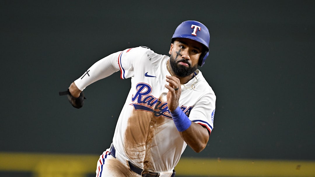 Sep 24, 2025; Arlington, Texas, USA; Texas Rangers shortstop Ezequiel Duran (20) scores from second base during the seventh inning against the Minnesota Twins at Globe Life Field. Mandatory Credit: Jerome Miron-Imagn Images