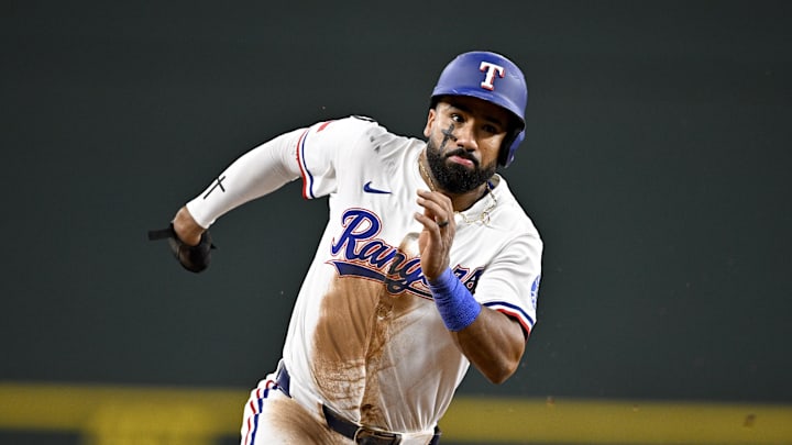 Sep 24, 2025; Arlington, Texas, USA; Texas Rangers shortstop Ezequiel Duran (20) scores from second base during the seventh inning against the Minnesota Twins at Globe Life Field. Mandatory Credit: Jerome Miron-Imagn Images