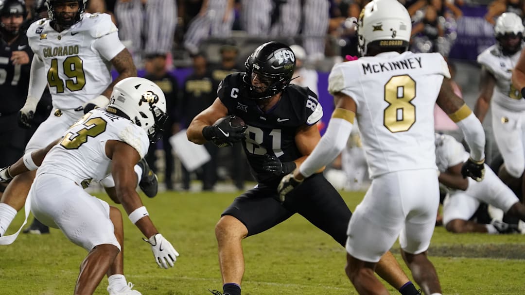 Oct 4, 2025; Fort Worth, Texas, USA; TCU Horned Frogs tight end Chase Curtis (81) runs after the catch as. Colorado Buffaloes defensive back Carter Stoutmire (23) defends during the second half at Amon G. Carter Stadium. Mandatory Credit: Raymond Carlin III-Imagn Images