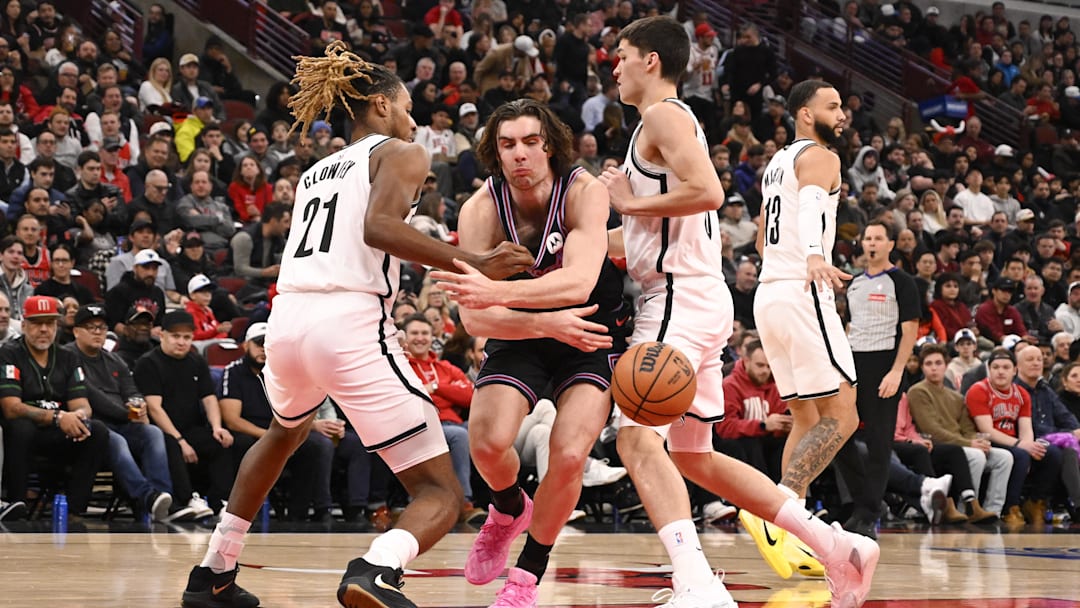 Dec 3, 2025; Chicago, Illinois, USA;  Chicago Bulls guard Josh Giddey (3) passes against Brooklyn Nets forward Noah Clowney (21) and guard Egor Demin (8) during the first half at the United Center. Mandatory Credit: Matt Marton-Imagn Images