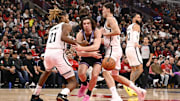 Dec 3, 2025; Chicago, Illinois, USA;  Chicago Bulls guard Josh Giddey (3) passes against Brooklyn Nets forward Noah Clowney (21) and guard Egor Demin (8) during the first half at the United Center. Mandatory Credit: Matt Marton-Imagn Images