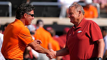 Oklahoma State head coach Mike Gundy shakes hands with Arkansas head coach Sam Pittman before the college football game between the Oklahoma State Cowboys and the Arkansas Razorbacks at Boone Pickens Stadium in Stillwater, Okla.,, Saturday, Sept., 7, 2024.