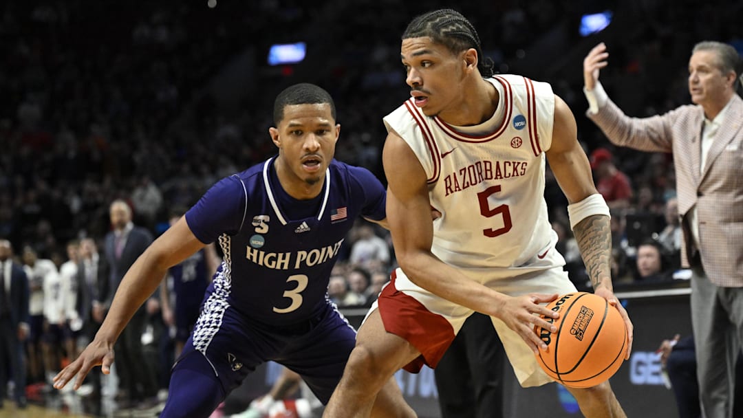 Arkansas Razorbacks guard Darius Acuff Jr. (5) drives against High Point Panthers guard Rob Martin (3) 