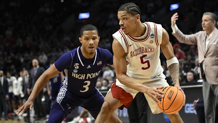 Arkansas Razorbacks guard Darius Acuff Jr. (5) drives against High Point Panthers guard Rob Martin (3) 