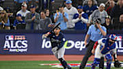Oct 20, 2025; Toronto, Ontario, CAN; Seattle Mariners first baseman Josh Naylor (12) hits an RBI single against the Toronto Blue Jays in the first inning during game seven of the ALCS round for the 2025 MLB playoffs at Rogers Centre. Mandatory Credit: Dan Hamilton-Imagn Images