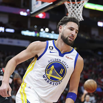 Mar 20, 2023; Houston, Texas, USA; Golden State Warriors guard Klay Thompson (11) reacts after scoring a basket during the second quarter against the Houston Rockets at Toyota Center. Mandatory Credit: Troy Taormina-Imagn Images