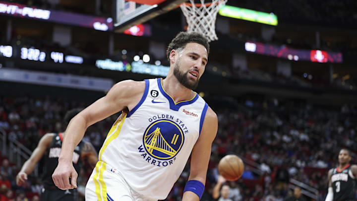 Mar 20, 2023; Houston, Texas, USA; Golden State Warriors guard Klay Thompson (11) reacts after scoring a basket during the second quarter against the Houston Rockets at Toyota Center. Mandatory Credit: Troy Taormina-Imagn Images