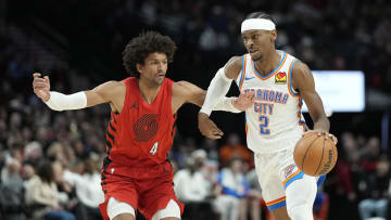 Mar 6, 2024; Portland, Oregon, USA; Oklahoma City Thunder point guard Shai Gilgeous-Alexander (2) dribbles the ball while defended by  Portland Trail Blazers shooting guard Matisse Thybulle (4) during the second half at Moda Center. Mandatory Credit: Soobum Im-USA TODAY Sports