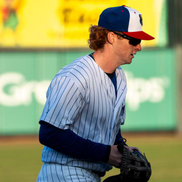 Iowa Cubs' Owen Caissie runs toward the dugout during a game against the Toledo Mud Hens at Principal Park on Tuesday, April 2, 2024, in Des Moines.