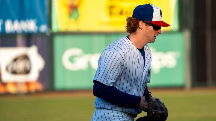 Iowa Cubs' Owen Caissie runs toward the dugout during a game against the Toledo Mud Hens at Principal Park on Tuesday, April 2, 2024, in Des Moines.