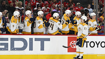 Dec 30, 2023; Washington, District of Columbia, USA; Nashville Predators right wing Luke Evangelista (77) is congratulated by teammates after scoring a goal against the Washington Capitals during the first period at Capital One Arena. Mandatory Credit: Brad Mills-Imagn Images