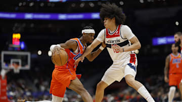 Jan 12, 2025; Washington, District of Columbia, USA; Oklahoma City Thunder guard Shai Gilgeous-Alexander (2) dribbles the ball as Washington Wizards forward Kyshawn George (18) defends in the third quarter at Capital One Arena. Mandatory Credit: Geoff Burke-Imagn Images