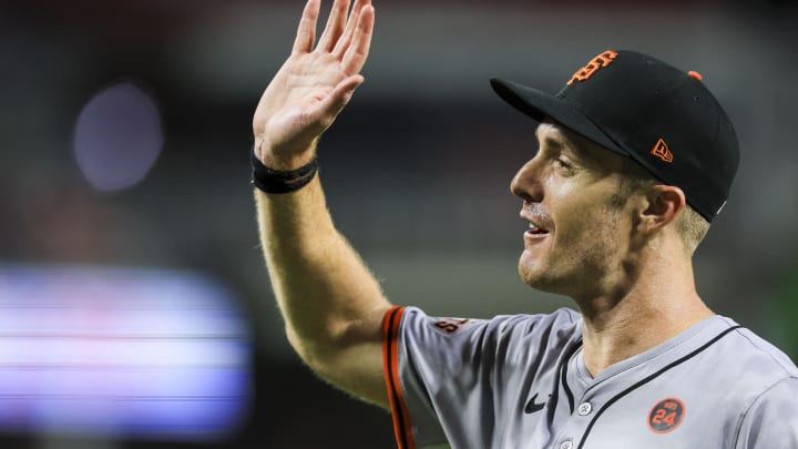 Aug 2, 2024; Cincinnati, Ohio, USA; San Francisco Giants first baseman Mark Canha high-fives teammates.