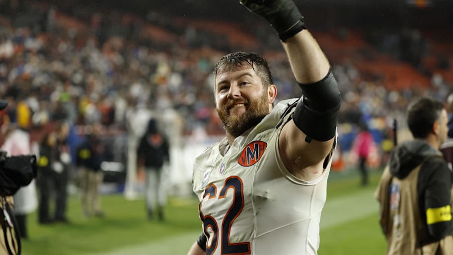 Joe Thuney raises a fist in the air.