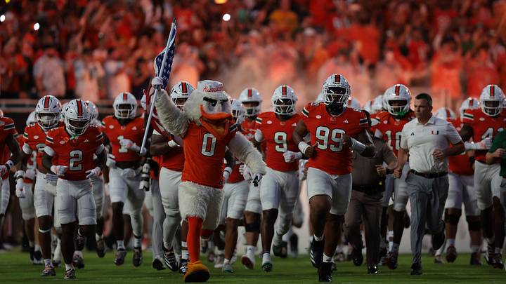 Aug 31, 2025; Miami Gardens, Florida, USA; The Miami Hurricanes take the field before the game against the Notre Dame Fighting Irish at Hard Rock Stadium. Mandatory Credit: Sam Navarro-Imagn Images