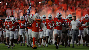 No. 5 Miami hosts No. 18 South Florida in a sneak-attack game that could be closer than the betting line indicates.