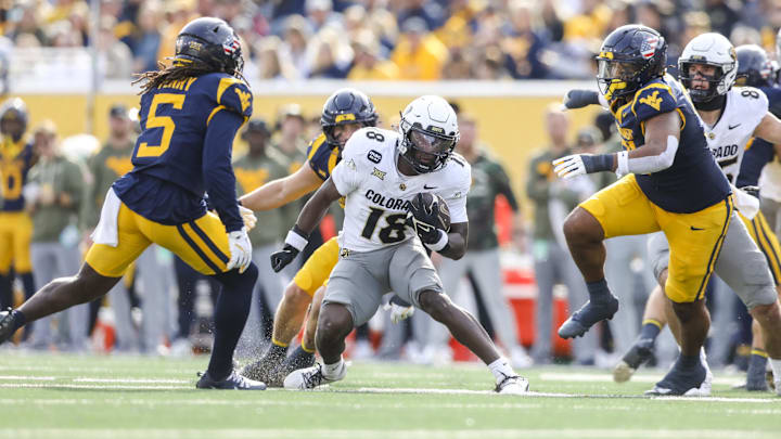 Nov 8, 2025; Morgantown, West Virginia, USA; Colorado Buffaloes wide receiver Kam Mikell (18) runs the ball during the second quarter against the West Virginia Mountaineers at Milan Puskar Stadium. Mandatory Credit: Ben Queen-Imagn Images