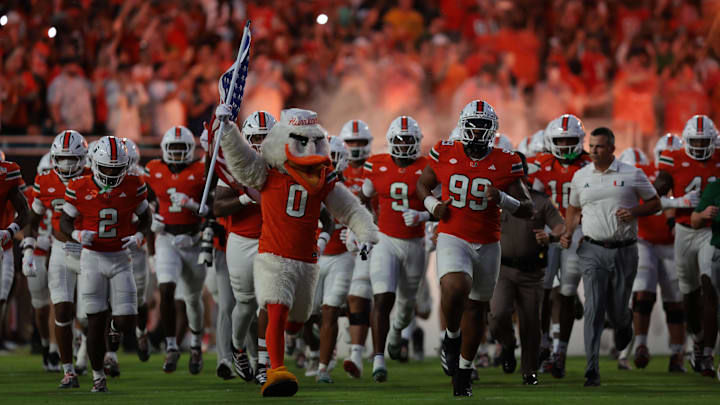 No. 5 Miami hosts No. 18 South Florida in a sneak-attack game that could be closer than the betting line indicates.