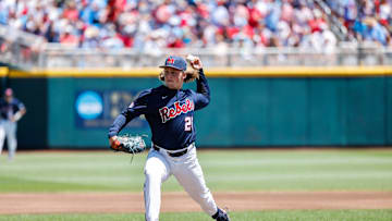 Jun 26, 2022; Omaha, NE, USA; Ole Miss pitcher Hunter Elliott (26) pitches during the first inning against the Oklahoma Sooners at Charles Schwab Field. Mandatory Credit: Jaylynn Nash-Imagn Images
