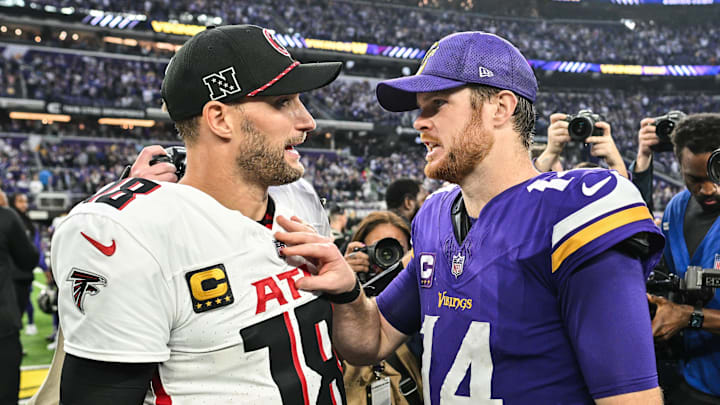 Dec 8, 2024; Minneapolis, Minnesota, USA; Atlanta Falcons quarterback Kirk Cousins (18) and Minnesota Vikings quarterback Sam Darnold (14) talk after the game at U.S. Bank Stadium. Mandatory Credit: Jeffrey Becker-Imagn Images