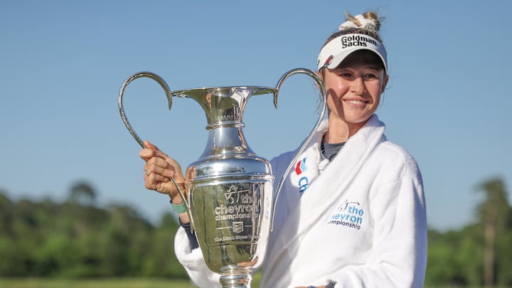 Apr 21, 2024; The Woodlands, Texas, USA; Nelly Korda (USA) poses with  the trophy after winning The Chevron Championship golf tournament. Mandatory Credit: Thomas Shea-Imagn Images