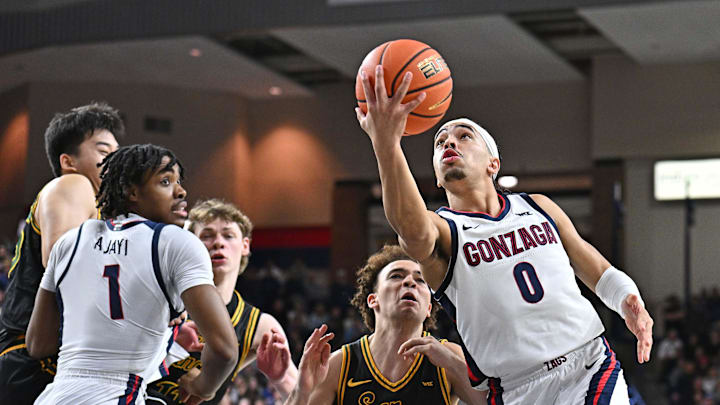 Feb 13, 2025; Spokane, Washington, USA; Gonzaga Bulldogs guard Ryan Nembhard (0) shoots against San Francisco Dons guard Ryan Beasley (0) in the first half at McCarthey Athletic Center. Mandatory Credit: James Snook-Imagn Images