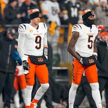 Cincinnati Bengals wide receiver Ja'Marr Chase (1), quarterback Joe Burrow (9) and wide receiver Tee Higgins (5) take the field as captains for the coin toss before the first quarter of the NFL Week 18 game between the Pittsburgh Steelers and the Cincinnati Bengals at Acrisure Stadium in Pittsburgh on Saturday, Jan. 4, 2025.