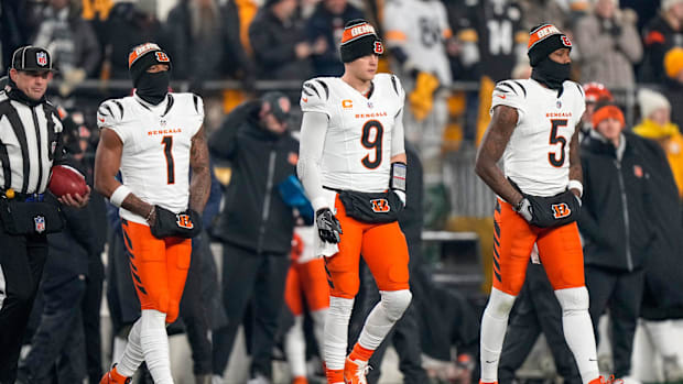 Bengals wide receiver Ja'Marr Chase (1), quarterback Joe Burrow (9) and wide receiver Tee Higgins (5) take the field.