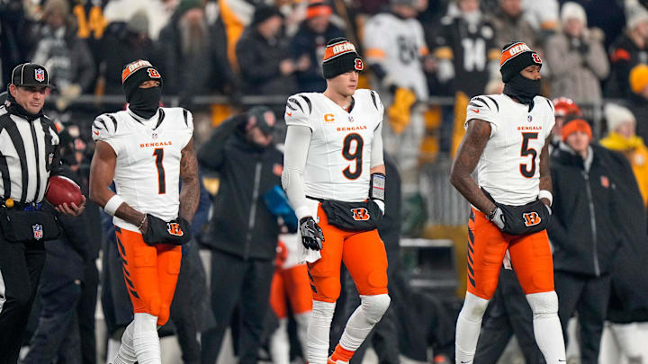 Cincinnati Bengals wide receiver Ja'Marr Chase, quarterback Joe Burrow (9) and wide receiver Tee Higgins 