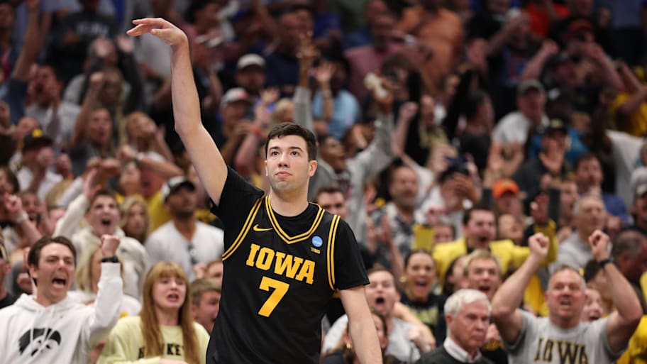 Iowa Hawkeyes forward Alvaro Folgueiras makes a go-ahead three-point basket against the Florida Gators.