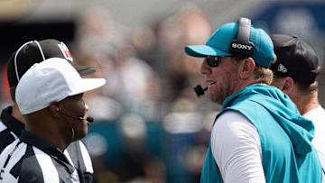 Carolina Panthers head coach Liam Coen talks to the referee and a line judge during the third quarter of an NFL football game between the Carolina Panthers at Jacksonville Jaguars at EverBank Stadium Sunday September 7, 2025. [Doug Engle/Florida Times-Union]