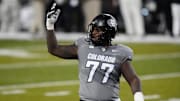 Nov 1, 2025; Boulder, Colorado, USA; Colorado Buffaloes offensive lineman Jordan Seaton (77) reacts to a penalty called during the second quarter against the Arizona Wildcats at Folsom Field. Mandatory Credit: Ron Chenoy-Imagn Images