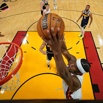 Miami Heat forward Jimmy Butler (22) dunks against the Denver Nuggets during the 2023 NBA Finals.